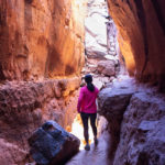 Woman; Hiker; Inside Cave; Light from Above; Soldiers Pass Hiking Trail; Soldiers Pass Caves; Sedona; Arizona; Northern Arizona Hiking Trails; Difficult Hiking Trails; Copyright azutopia.com. No use without permission.