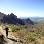 Hiker; Bell Pass Hiking Trail; Phoenix Area; Arizona; McDowell Mountains; Pass; Mountaintop; Scottsdale; Mountains; Saquaros; Rocky Outcropping; View; Camelback Mountain; Piestewa Peak; Difficult Hiking Trails; Copyright azutopia.com. No use without permission.