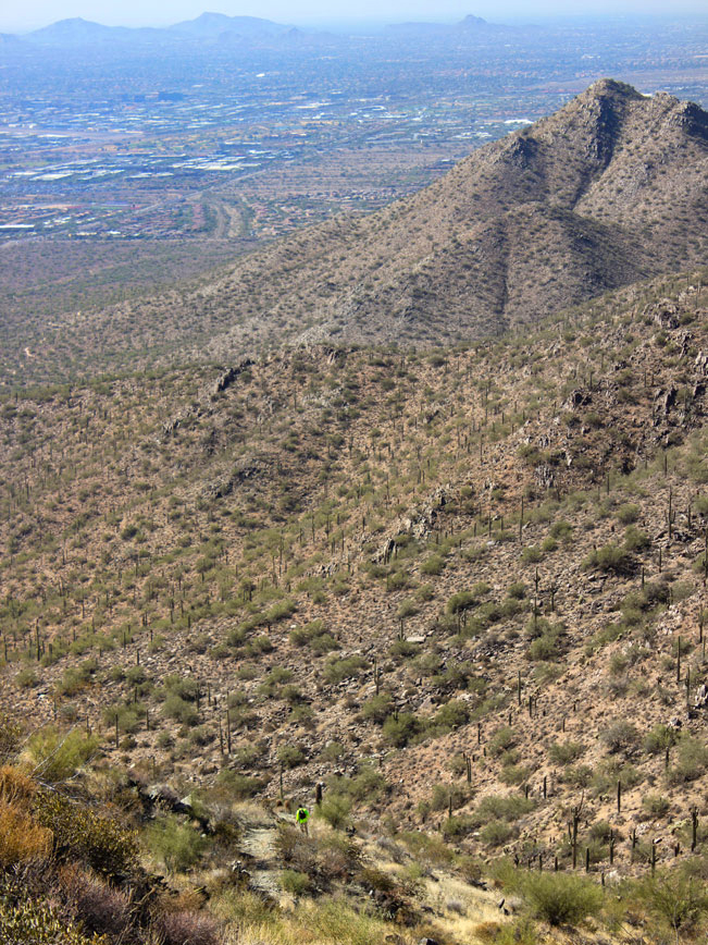 Hiker; Descending; Bell Pass Hiking Trail; Phoenix Area; Arizona; McDowell Mountains; Scottsdale; Mountains; Saquaros; View; Difficult Hiking Trails; Copyright azutopia.com. No use without permission.
